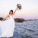 bride at waters edge venue in Texas